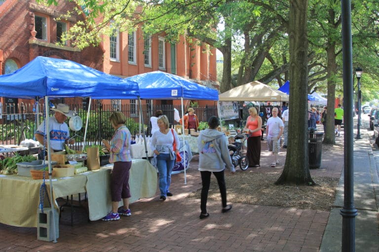 Patrons browse produce booths at the Olde Towne Portsmouth Farmers Market