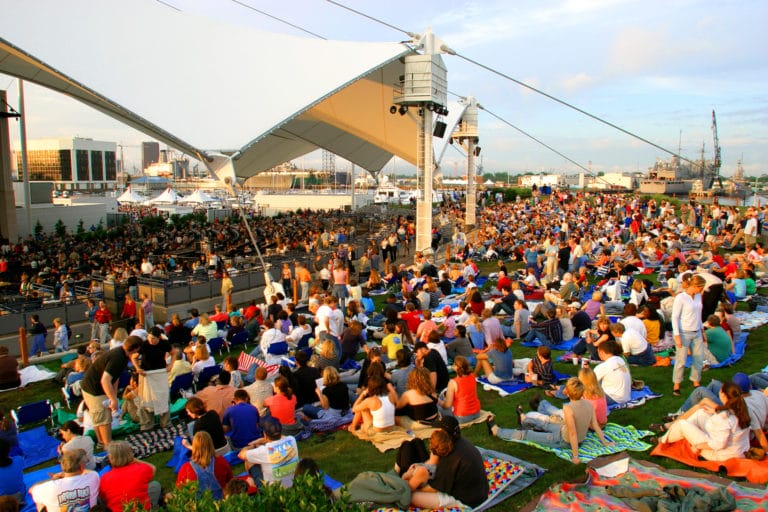 Patrons covering the lawn at the Atlantic Union Bank Pavilion in Portsmouth, Virginia.