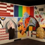 Mural created by students features geometric shapes, variety of color,, plants, animal, still life, , jet and more