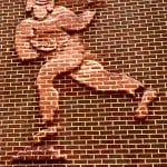 Bas Relief Sculpture of Athletes in brick