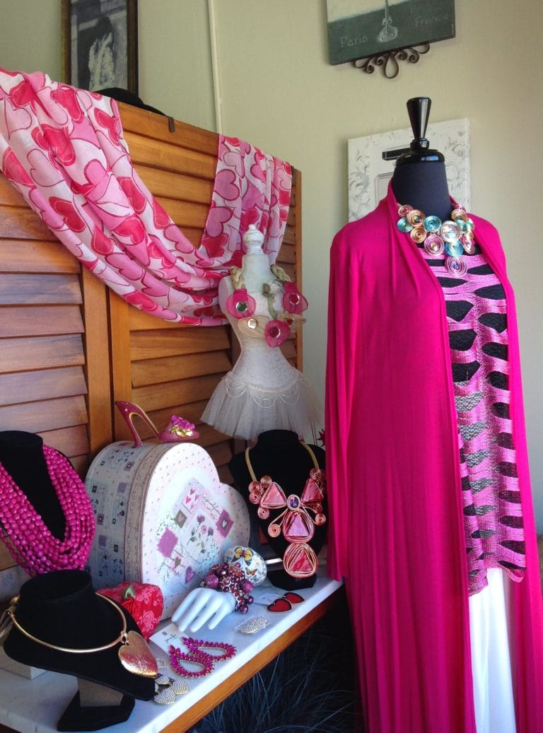 A pink clothes and jewelry display at Finer Things Boutique in Portsmouth, Virginia