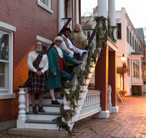 Reenactors pose on an outdoor staircase in Portsmouth, Virginia