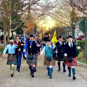 Men in kilts march in the Annual Scottish Walk in Olde Towne Portsmouth