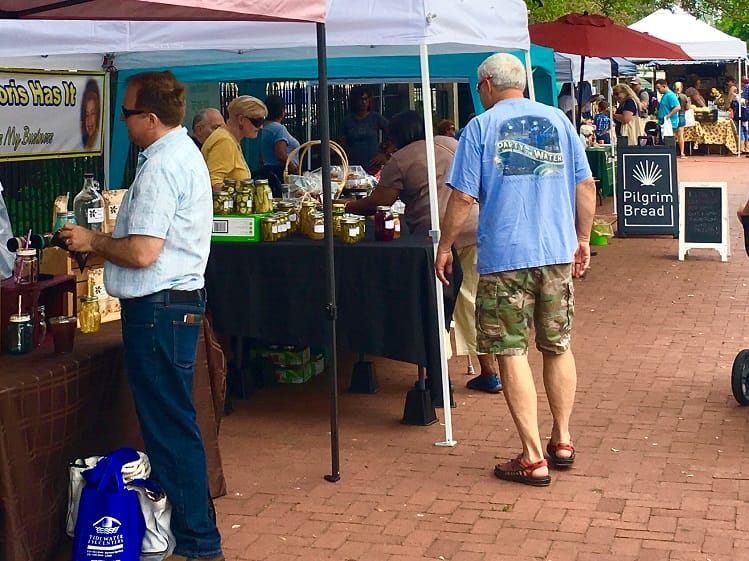 Vendors selling canned pickles and bread at the Olde Towne Portsmouth Farmers Market Vendors selling canned pickles and bread at the Olde Towne Portsmouth Farmers Market