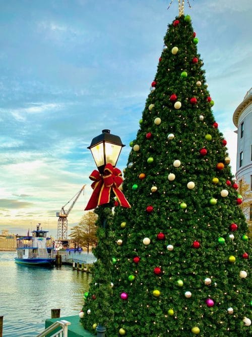 Christmas tree at High Street Landing with a ferry in background 