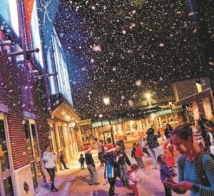 Snow falls on shoppers in Olde Towne Portsmouth
