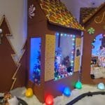 A gingerbread house with a Christmas tree inside at Winter Wonderland 2021