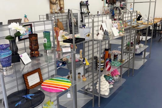 display shelf with workshop table in background