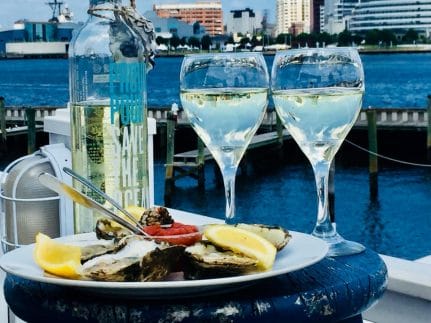 A plate of oysters on an outdoor table at Fish and Slips in Portsmouth, Virginia