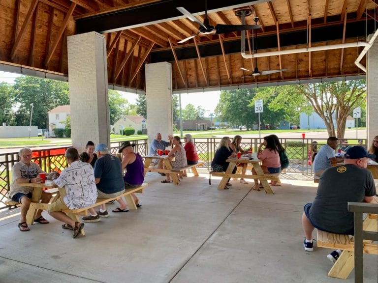 Patrons sip beer at the outdoor patio at Harbor Trail Brewing Company