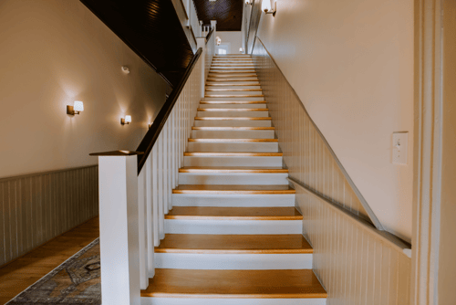 Wooden staircase inside Cambridge Hall, a Virginia historical site Wooden staircase inside Cambridge Hall, a Virginia historical site
