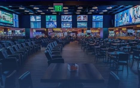 Seats and TVs inside Betrivers Sportsbook at Rivers Casino in Portsmouth, Virginia.