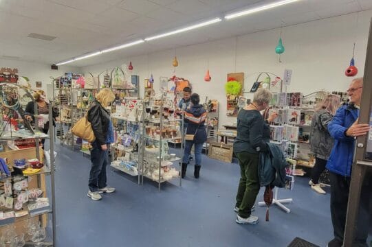 People walking around inside of an art store in Olde Towne Portsmouth, VA