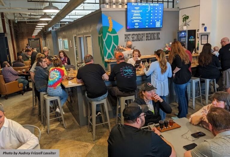 Patrons sip beers at Post Secondary Brewing in downtown Portsmouth