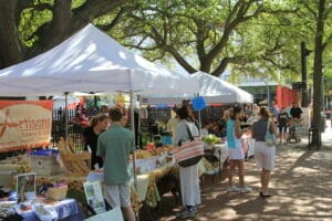 Patrons visit booths at the Olde Towne Farmer's Market in Portsmouth, Virginia