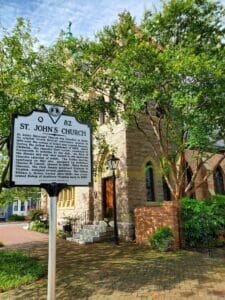 image of a historical marker with text in front of St johns church in Portsmouth va.