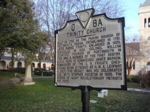 image of a historical marker with text in front of Trinity Episcopal church in Portsmouth VA.