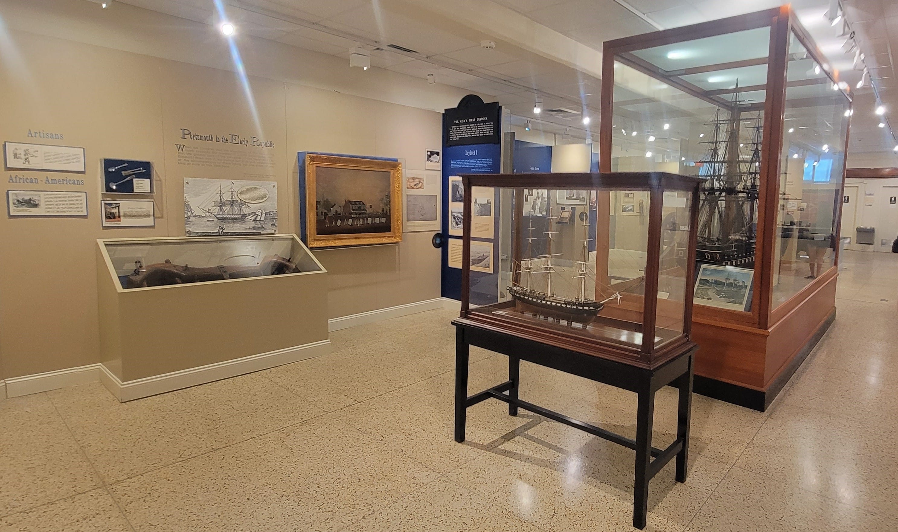 Image of artifacts inside glass cases in the Portsmouth Naval Shipyard Museum in Portsmouth VA