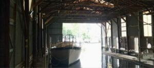 Boat floating inside the wet shed at Newell's Boat Works